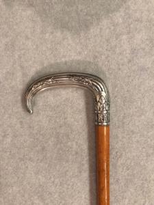 Cane with silver knob and plant decorations, malacca shaft.