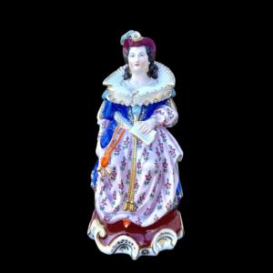 Figurative veilleuse-teapot with a figure of a seated lady. France.