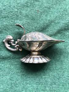 Silver gravy boat in the shape of a shell. Spain.