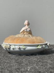 Porcelain 'half doll' powder box with lady figure and embossed flowers. France.