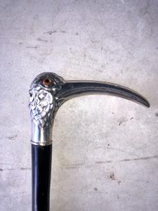 Cane with silver handle depicting an Ibis bird, ebony shaft.