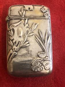 Silver matchbox without hallmark with Art Nouveau dragonfly and rocaille shield pond decoration.