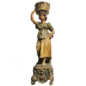 Polychrome wooden sculpture depicting a female figure