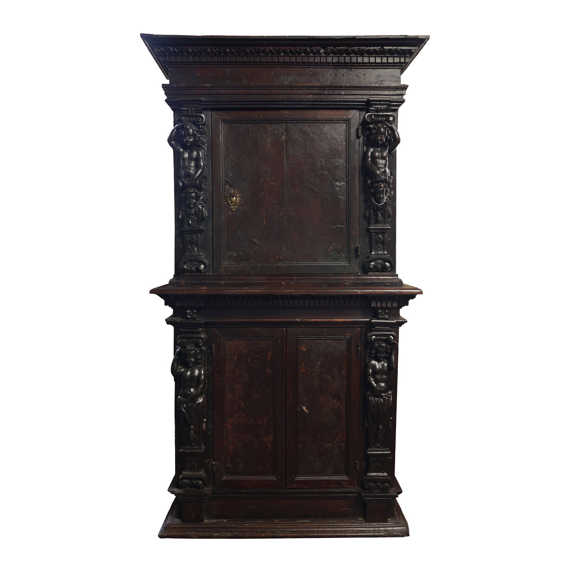 Double body in wood and walnut veneer. Upper body with one door and two anthropomorphic caryatids on the sides. Lower body with two doors and cherub heads on the sides. Lombardy, 17th century