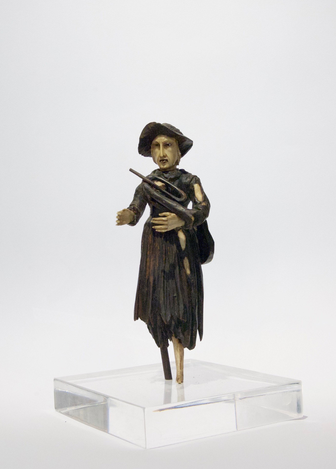 German manufacture, early 19th century, Beggar with wooden trumpet, bone, and transparent plexiglass base.