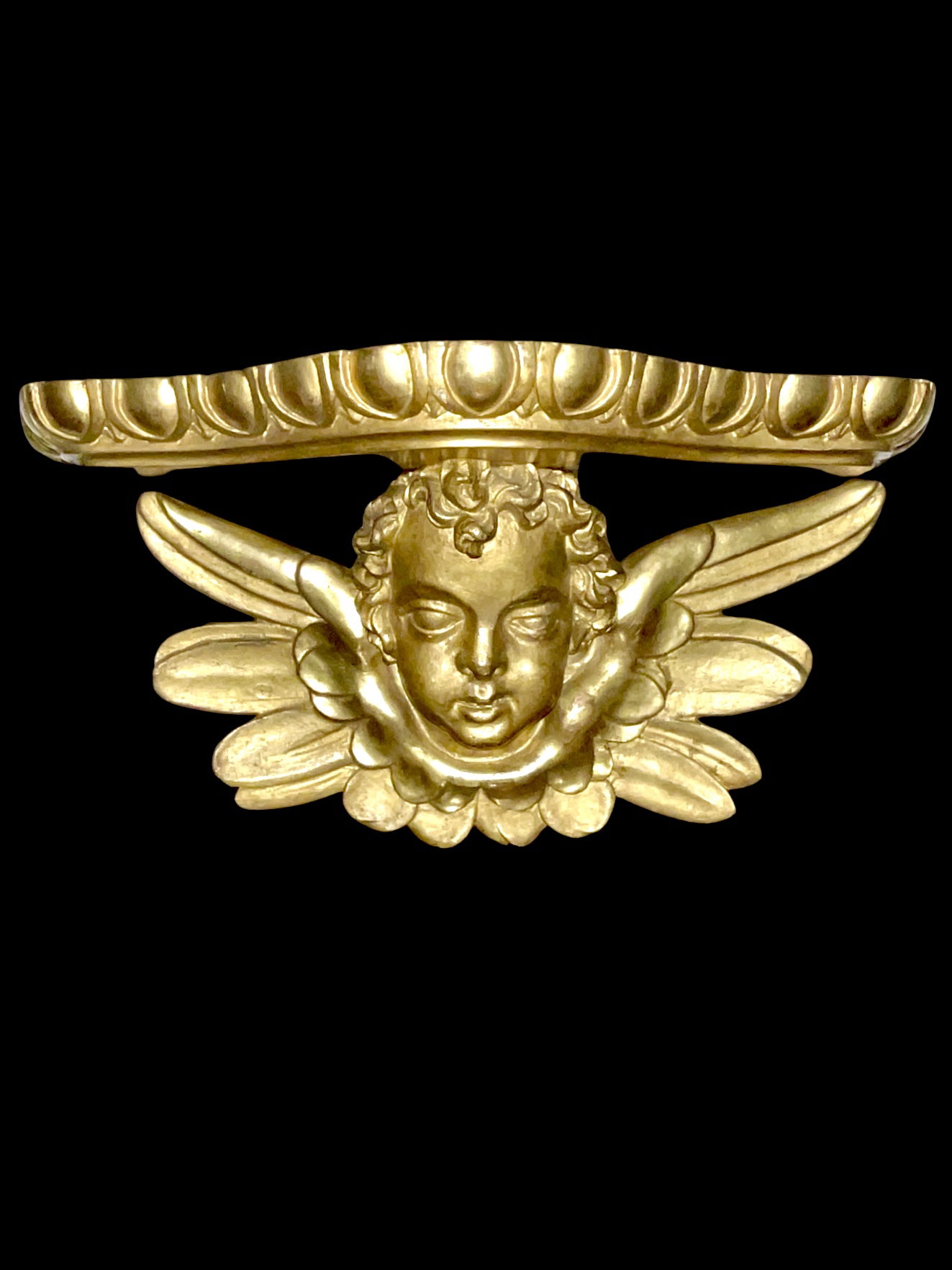 Mensola-applique in legno scolpito e foglia oro con testa di angelo cherubino.Periodo direttorio.
