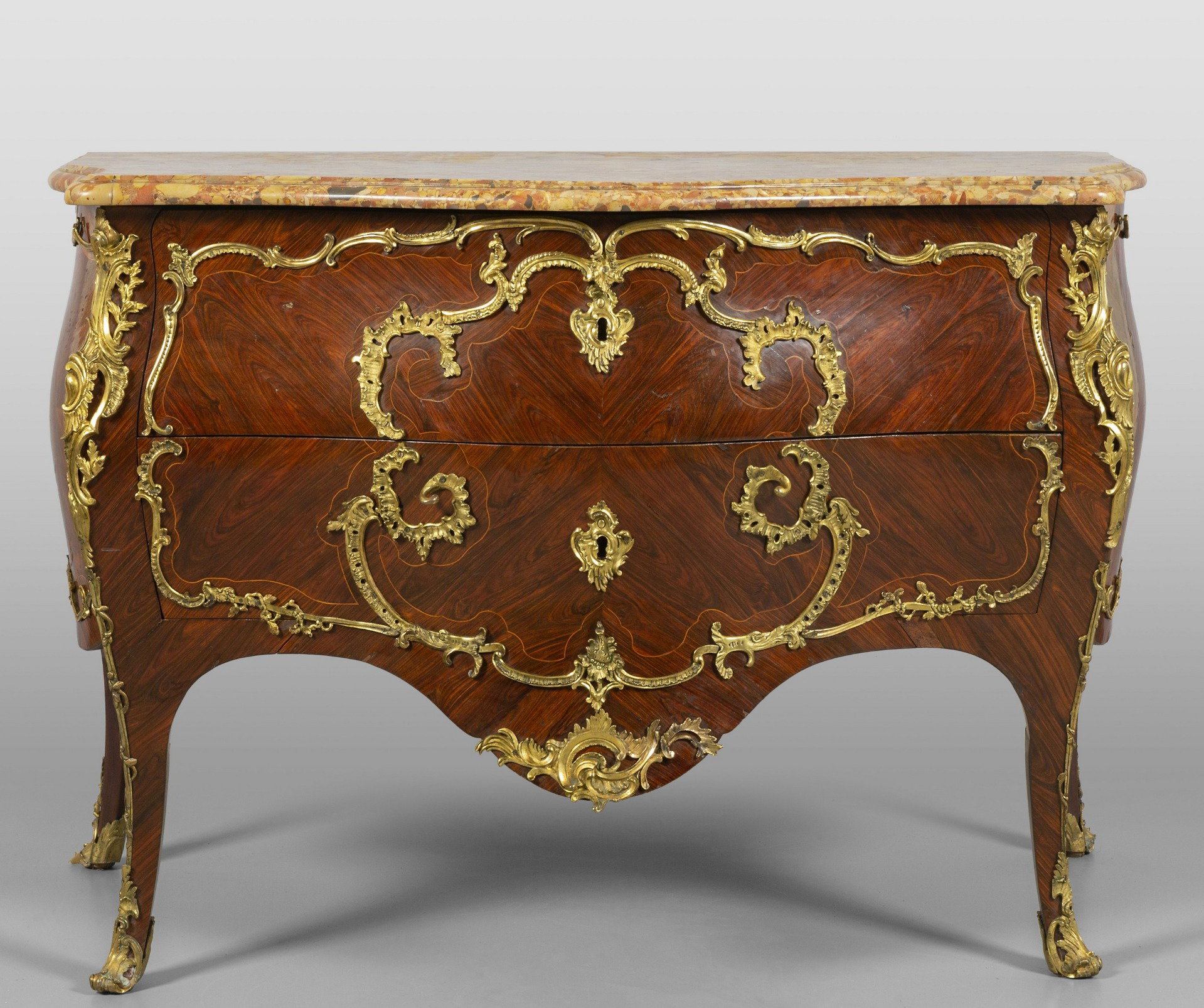 Louis XV commode veneered in kingwood, rich gilded bronze decoration, France 18th century