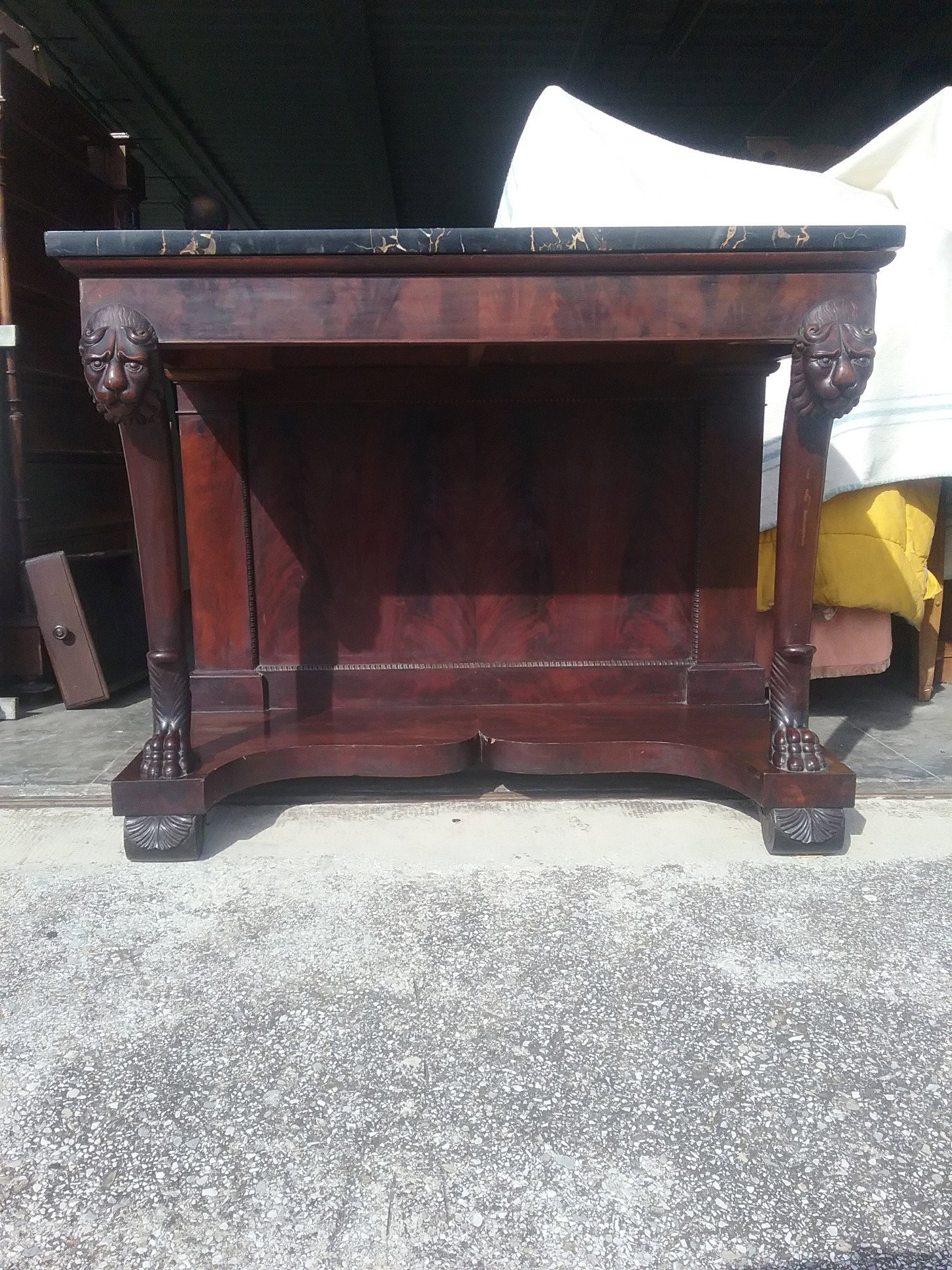 Console table in striped mahogany, decorated with Portoro marble, and with Lucchese panther features from the early 1800s. L125xH96xD63, warranty under the terms of law.