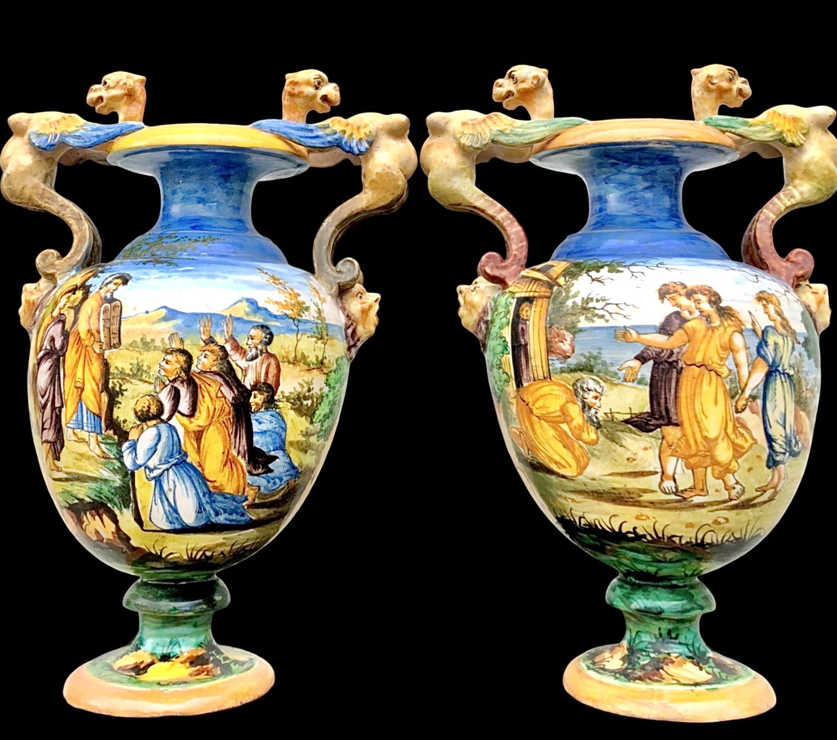 Pair of majolica vases with handles and Urbino-style historical decoration. S.C.A Pesaro mark