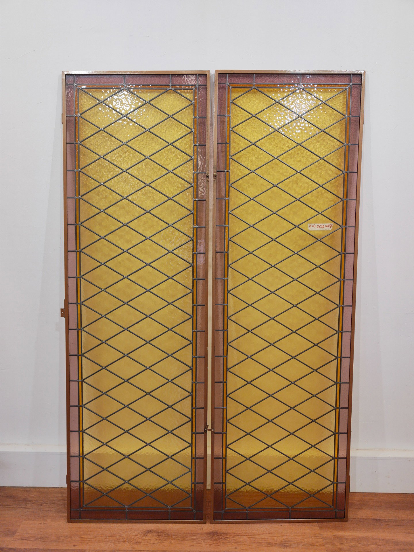 Pair of early 20th century leaded cathedral stained glass windows 206x65.5cm