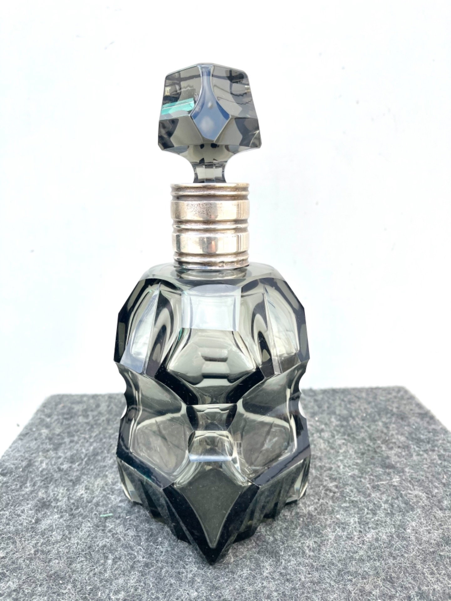 Art Deco faceted crystal bottle with silver neck. Sterling hallmark (925 high grade silver). USA.