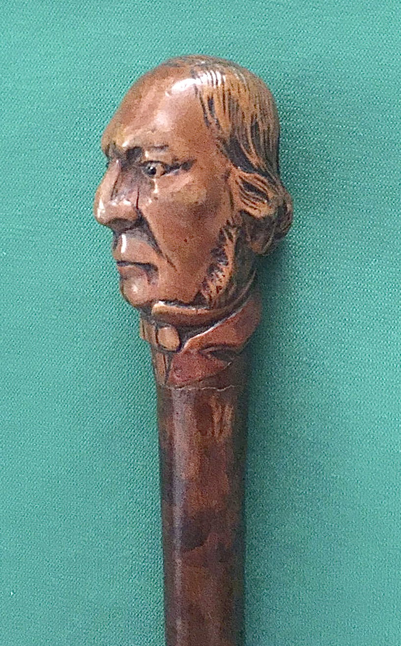Gehstock mit Knauf aus Buchsbaumholz, der einen männlichen Kopf darstellt, Schaft aus Obstbaumholz.
