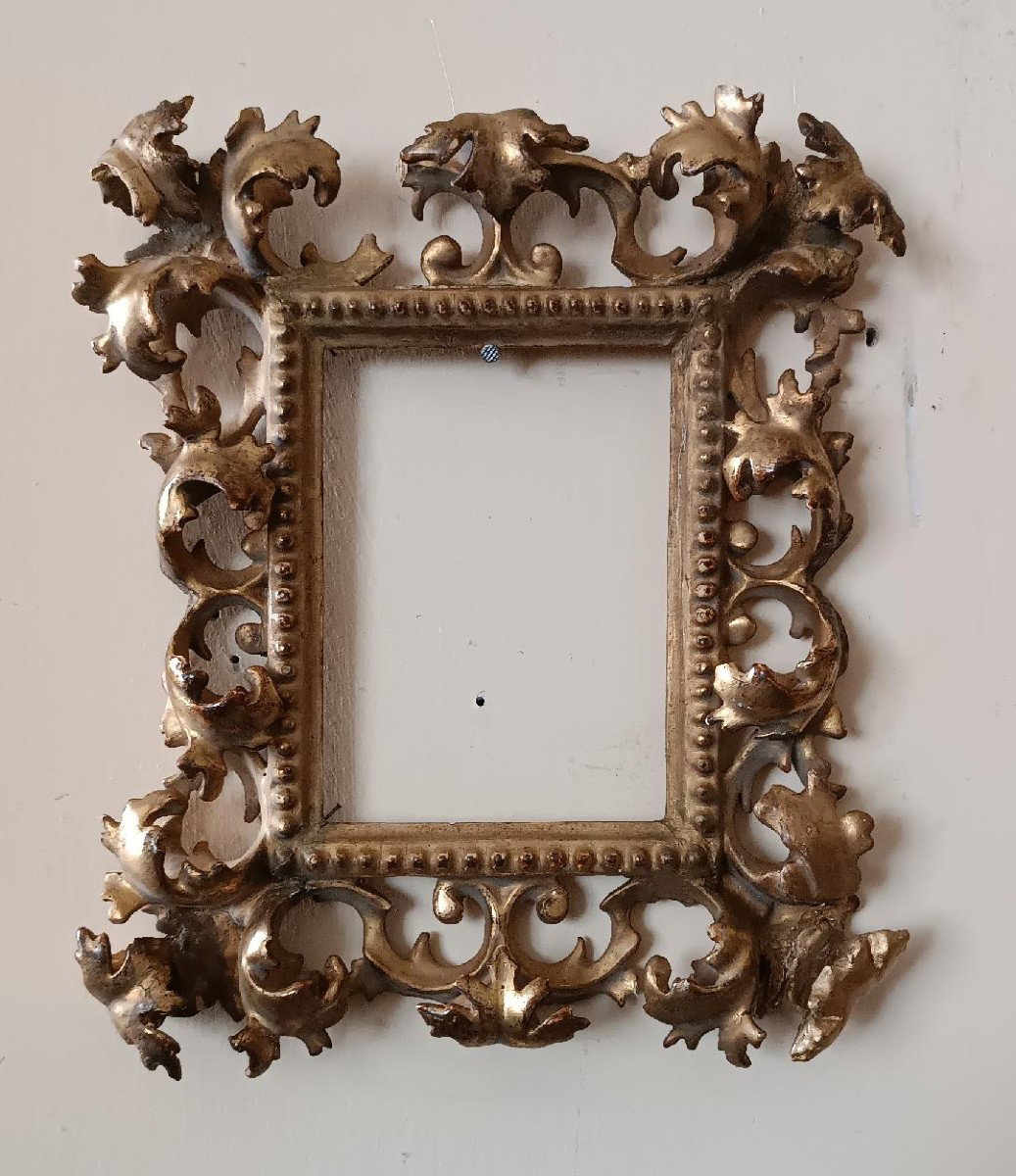 Antica cornice in legno intagliato e dorato ,cartoccio, Toscana XIX secolo