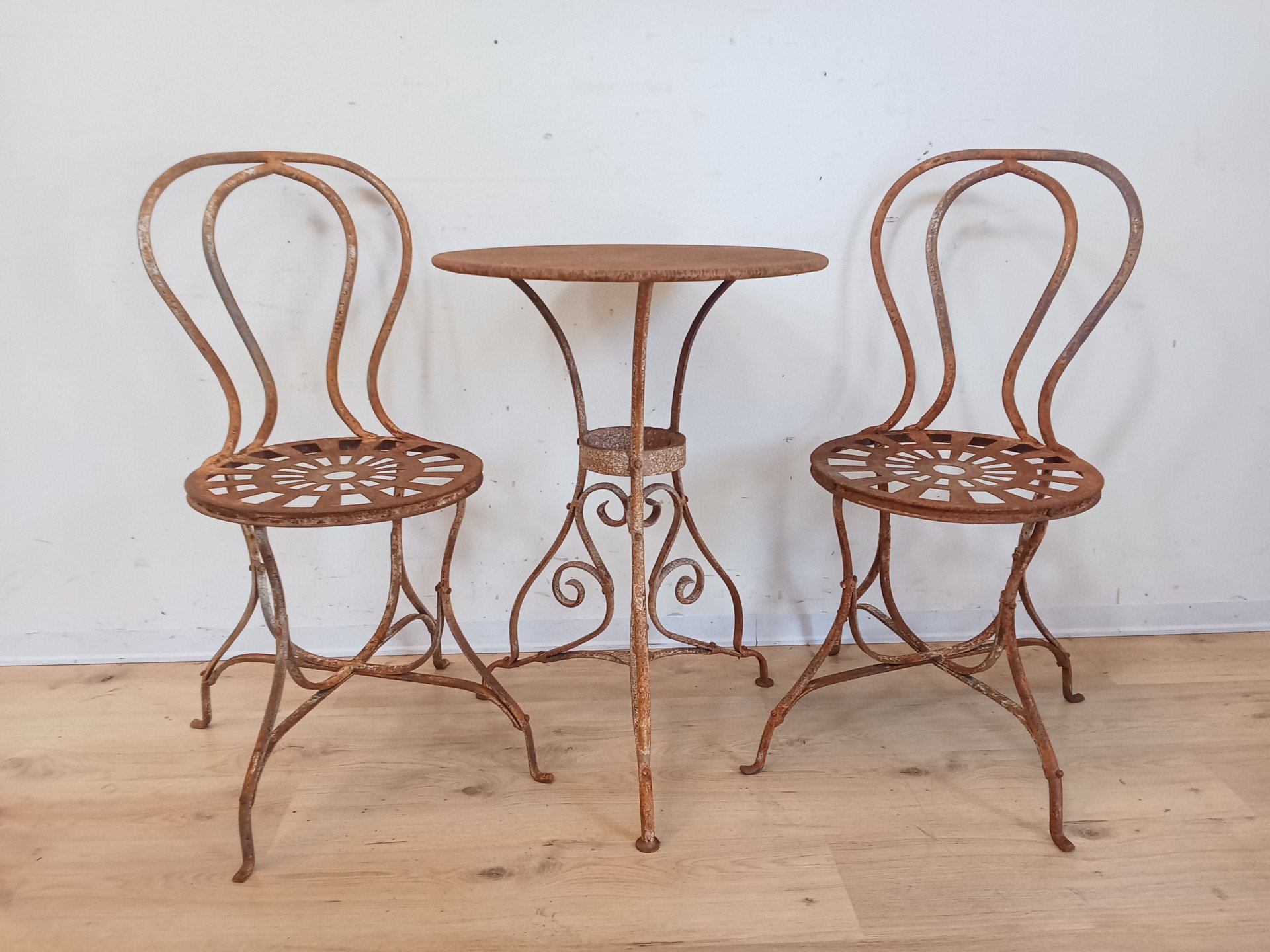 Garden table and two chairs set in wrought iron - early 1900s