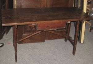 Wooden trestle table with drawer