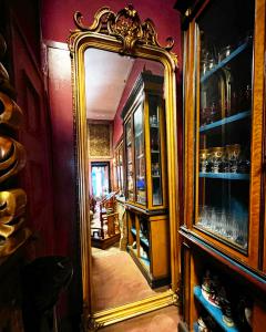 Rectangular gold mirror. Height 280 cm x Width 104 cm. Period and end of the 19th century, France.