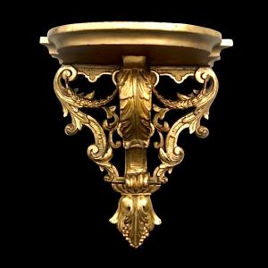 Mensola in legno e foglia oro con festoni ,volute rocaille e motivi vegetali stilizzati.Periodo Luigi XVI.