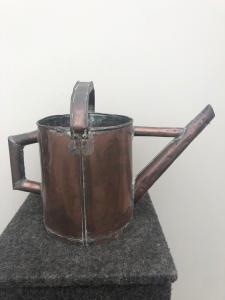 Copper watering can.