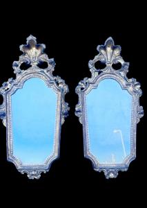 Pair of carved and gilded wooden mirrors with floral and rocaille motifs. Venice.