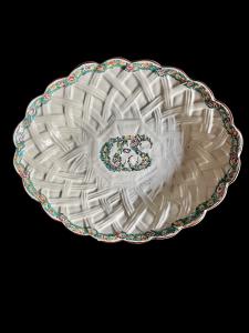 Oval majolica dish with raised basket-weave border and floral initials in the center. Felice Clerici manufacture. Milan.