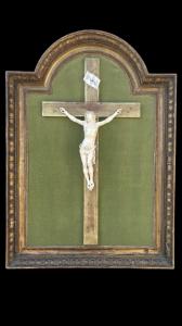 Ivory Christ with carved and gilded wooden cross and frame. Louis XVI period.