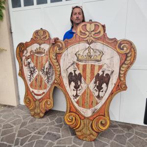 Pair of painted wooden noble shields from the 20th century