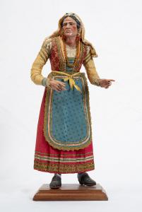Scultura presepiale napoletana raffigurante "Popolana" avente testa in terracotta con occhi di cristallo e arti in legno policromo.