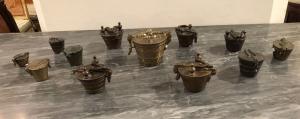 Collection of twelve burnished bronze weight holders from various eras from the 17th to the 19th century