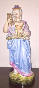 Figurative veilleuse teapot in polychrome porcelain in the shape of a lady with a dog. Jacob Petit model. France. 38 cm.