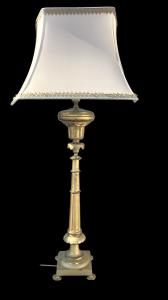 Bronze lamp with square base and four feet.