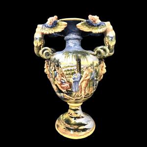 Pair of large vases with historical decorations and handles in the shape of harpies. Minghetti Manufacture. Bologna.