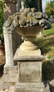 Stone vase with fruit