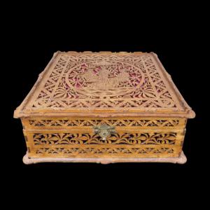 Sweet wood box perforated with neoclassical, vegetable and stylized geometric motifs. Italy.