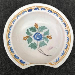Round shaving dish with floral decoration. France.
