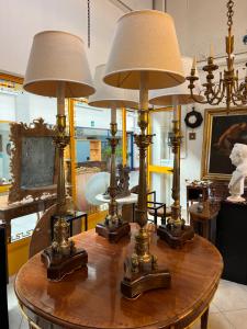 Four bronze candelabra