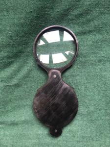 Dark horn magnifying glass.