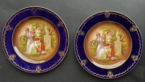 Pair of painted plates with mythological figures
