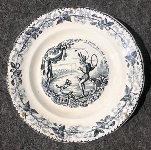 Earthenware plate with decal decoration depicting a circus scene. Choisy le Roi manufacture. France.