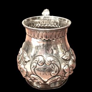 Silver beaker with embossed floral and rocaille motifs. London 1860