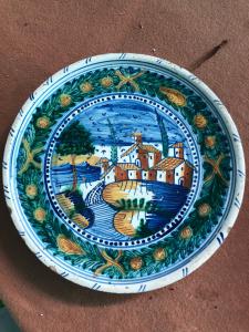 Majolica raised plate with landscape and architecture decoration, Urbania (Casteldurante) manufacture.