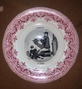 Earthenware plate with decal decoration. Inscription: L'ombromanie. France