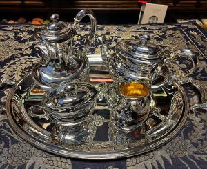 800 silver tea set consisting of teapot, coffee pot, milk jug, sugar bowl and tray. Late 1800s.