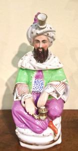 Porcelain veilleuse teapot depicting a Sultan. Jacob Petit model. France.