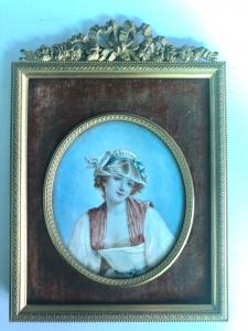 Miniatura  con figura femminile.Cornice in bronzo.
