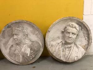 Four Carrara marble bas-reliefs.