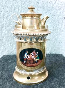 Gilded porcelain veilleuse teapoy with medallions depicting a scene with people in a tavern and a landscape with architecture. France, Empire period.