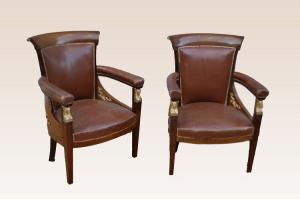 Three Empire mahogany armchairs from the 1800s with rich bronze details