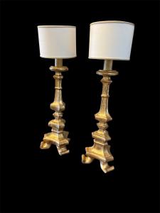 Two gilded wooden candelabra