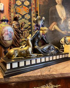 Early 20th century bronze sculpture, 20th century sculptor, bronze and marble group depicting a girl with a deer.