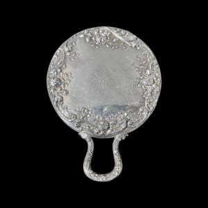 Silver mirror with rocaille and floral motifs. Sterling hallmark.
